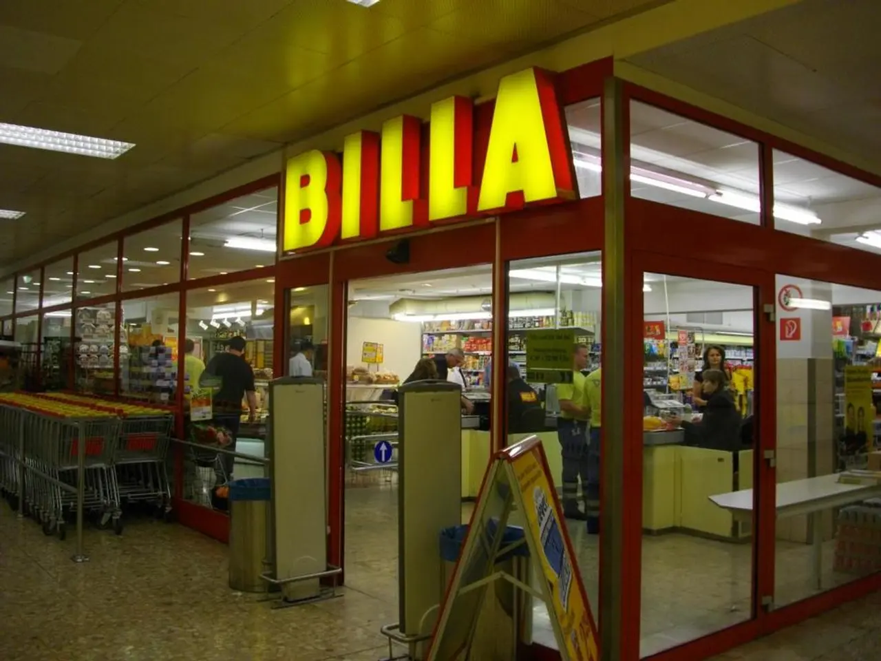 In this image it looks like it is a mart. In the middle there is an entrance. Beside the entrance...
