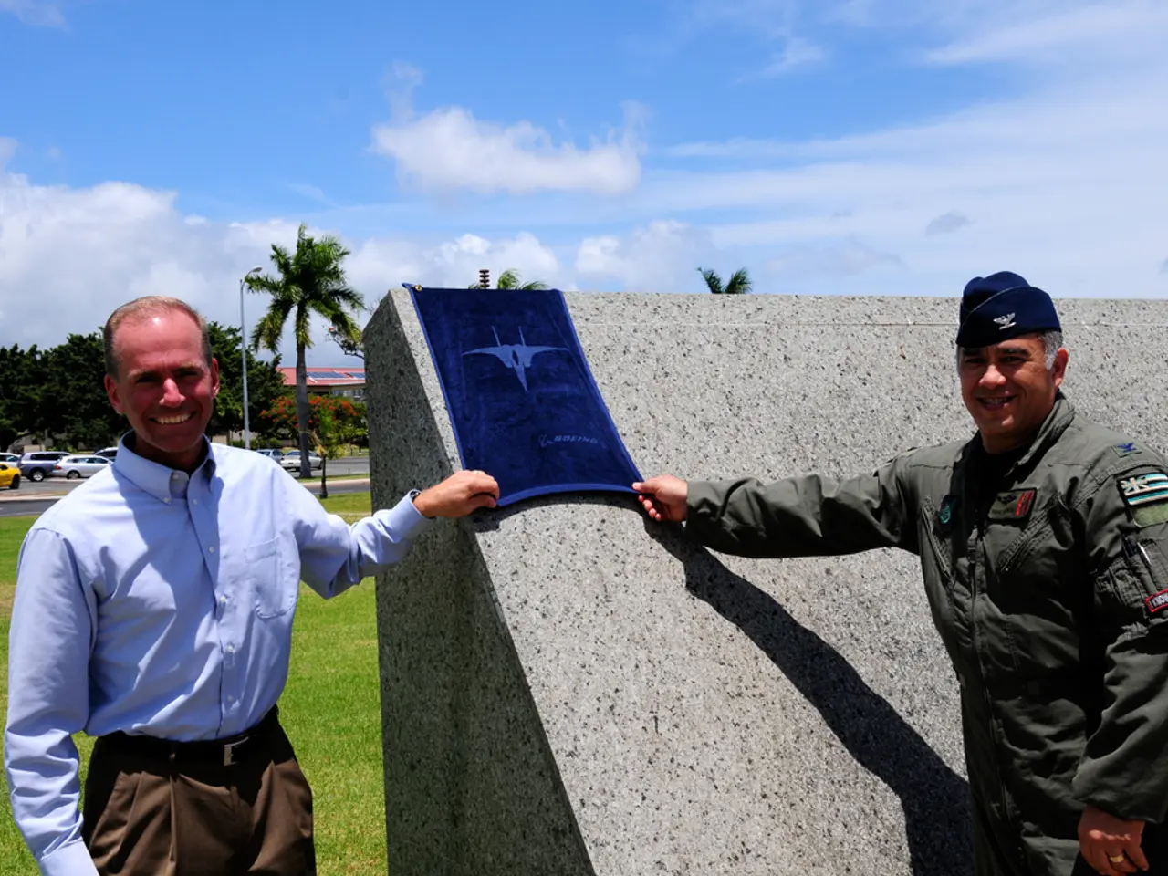 In this image, on the right there is a man, he is smiling, he is holding a flag. On the left there...