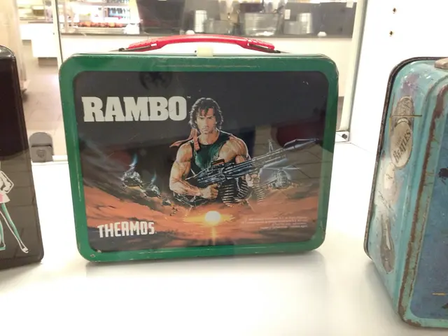 In this image I can see in the middle it looks like a bag, in this image there is a man holding the...