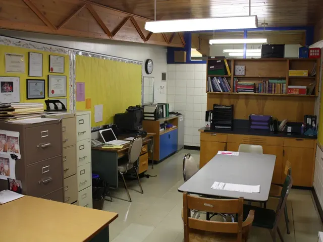 In this image there is cupboard , papers stick to cupboard, book in the table , chair , laptop in...