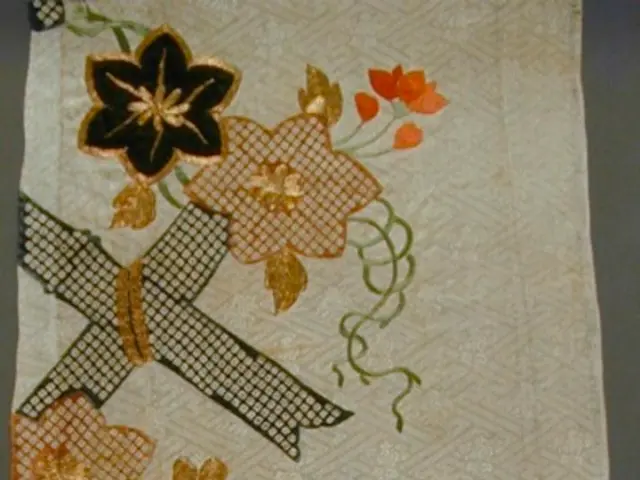 In this image, we can see a design on the cloth.