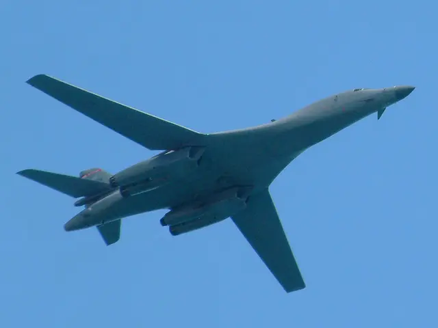 In this image we can see an aircraft flying in the sky.