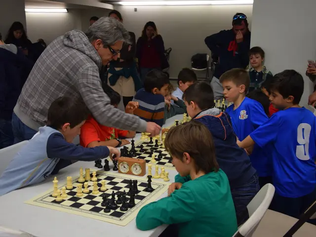 In the picture there are kids playing chess,this seems to be a chess competition and at background...
