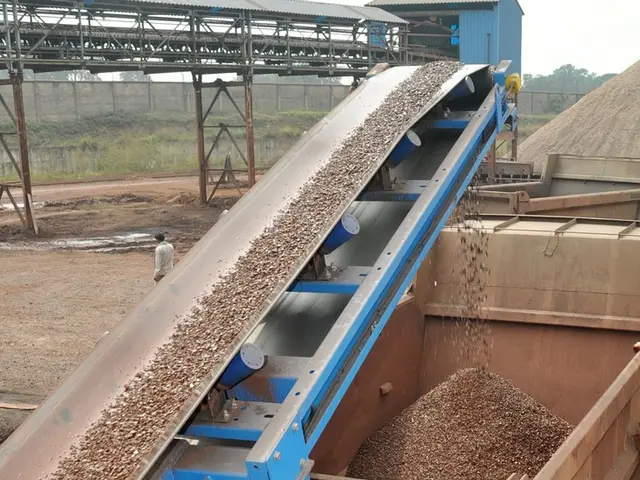 In this image, we can see a truck. At the bottom, there is a mud. Here there is a machine....