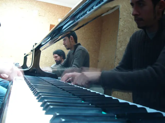 As we can see in the image there are few people playing musical keyboard.